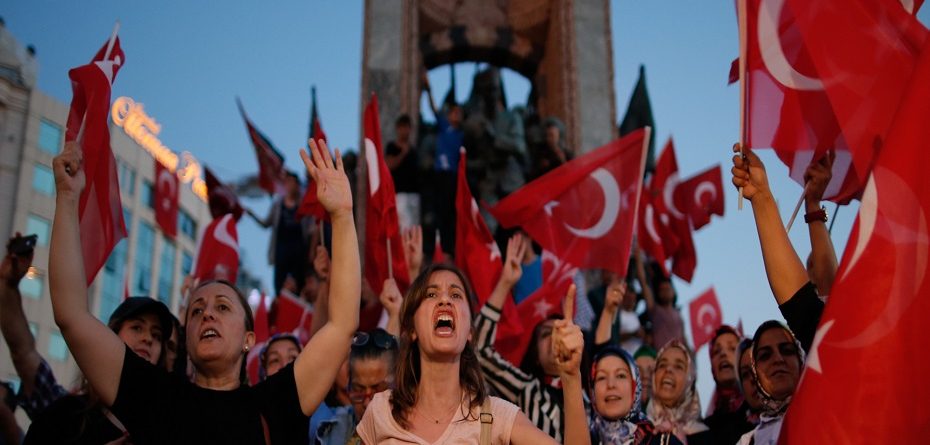 People chant slogans as they gather at a pro-government rally in central Istanbul's Taksim square, Saturday, July 16, 2016. Forces loyal to Turkish President Recep Tayyip Erdogan squashed a coup attempt in a night of explosions, air battles and gunfire that left some hundreds of people dead and scores of others wounded.  (AP Photo/Emrah Gurel)